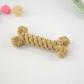 Load image into Gallery viewer, Close-up of tan braided cotton rope dog chew toy with bone shape on white background
