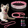 Load image into Gallery viewer, White dog wearing pink crystal-embellished collar and matching leash on black background
