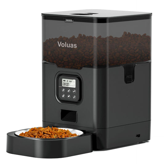 Black automatic pet food feeder with digital control panel and removable stainless steel bowl filled with kibble