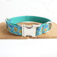 Load image into Gallery viewer, Close-up detail of teal floral dog collar with metal buckle and floral pattern
