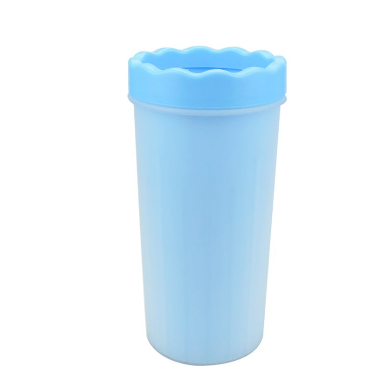 Blue silicone dog paw washer cup upright on white background