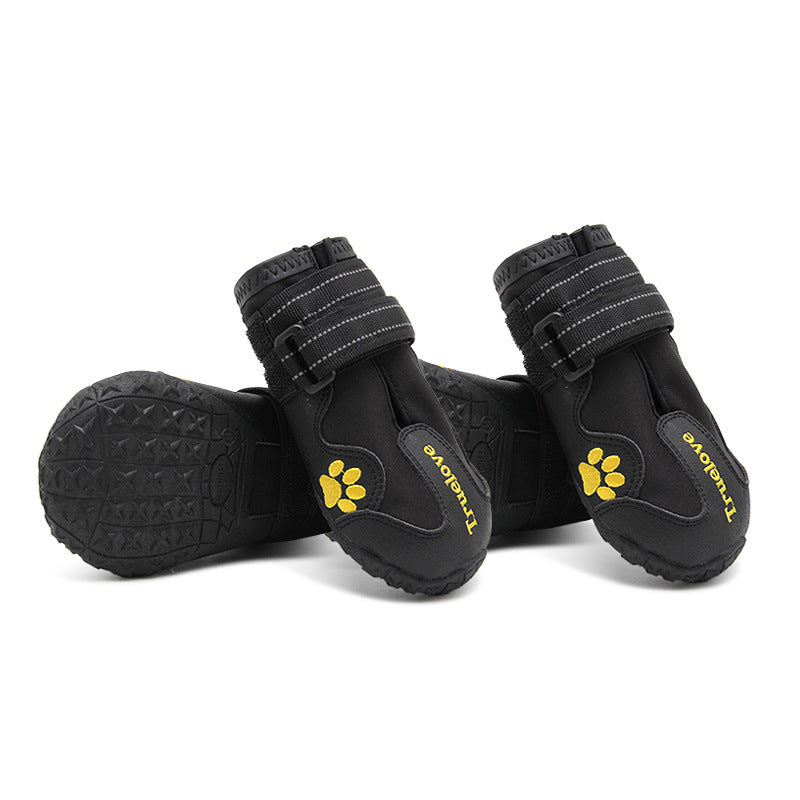 Pair of black and gray waterproof dog shoes with velcro straps displayed on white background