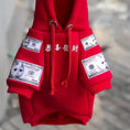 Load image into Gallery viewer, Red cotton fleece pet hoodie with money print and hood laid flat showing drawstrings and ribbed cuffs

