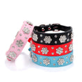 Load image into Gallery viewer, Pink, black, red, and blue PU leather dog collars decorated with rhinestone flowers laid flat
