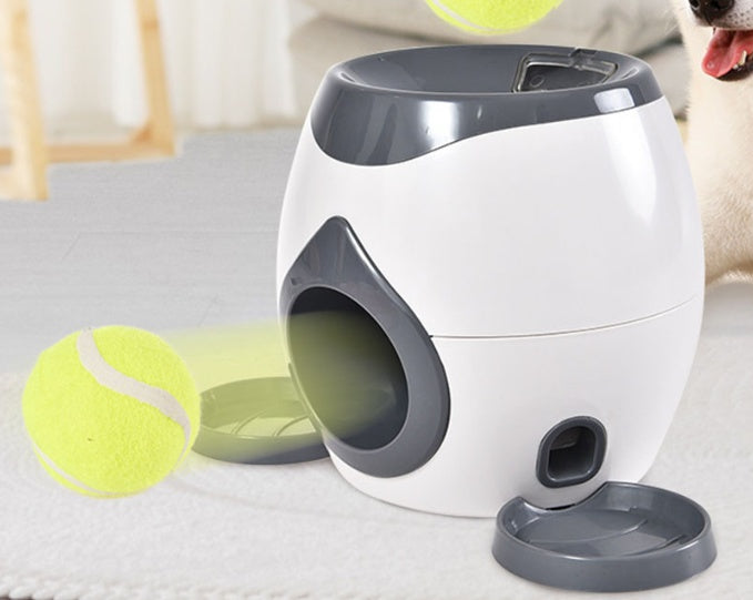 White and gray feeder with tennis balls shown rolling out of the machine