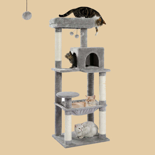 Full view of a gray plush multi-level cat tree with scratching posts and cats playing on different levels