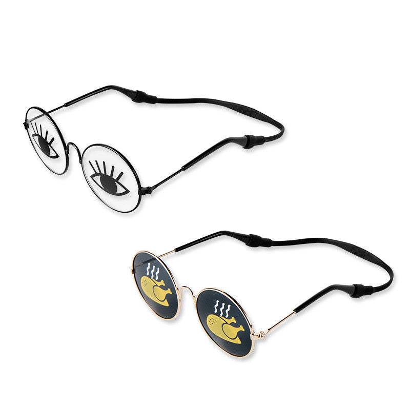 Close-up of the cartoon eye design sunglasses with black plastic frames and adjustable straps