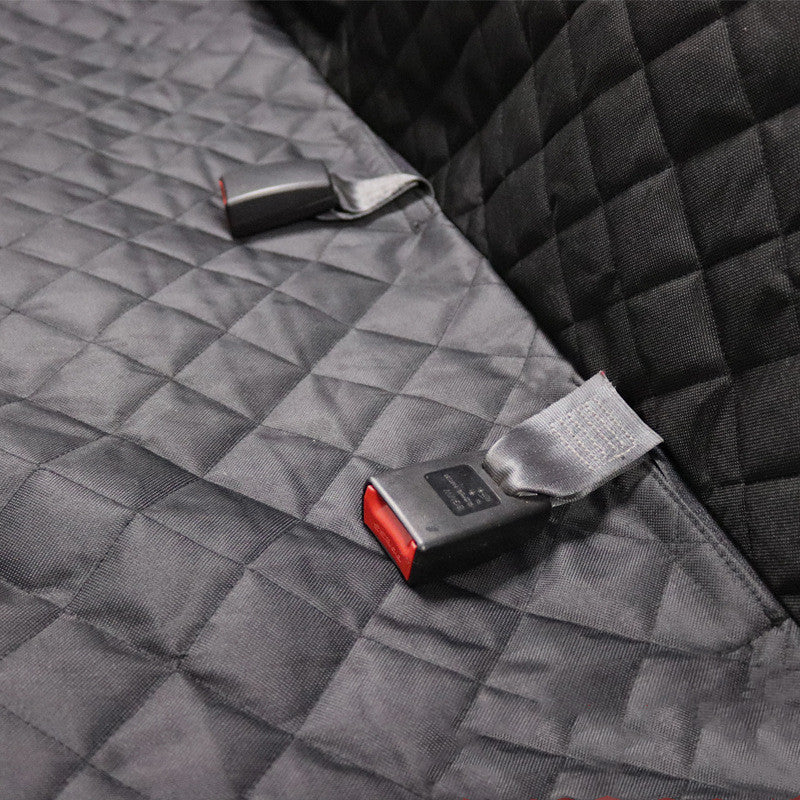 Seat belt buckle cutouts on quilted mat for easy access and safe installation