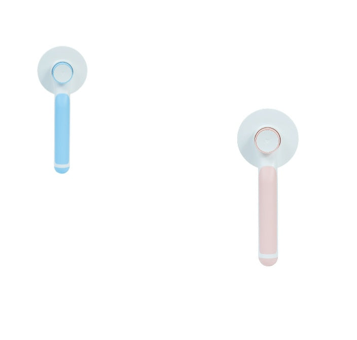 Blue and pink handled pet hair combs displayed showing their ergonomic handles