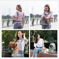 Load image into Gallery viewer, Woman carrying a shoulder pet carrier backpack with cat peeking out front window walking on boardwalk
