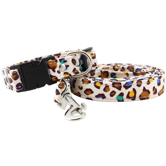 Leopard print dog collar and matching leash with metal clips and black buckle