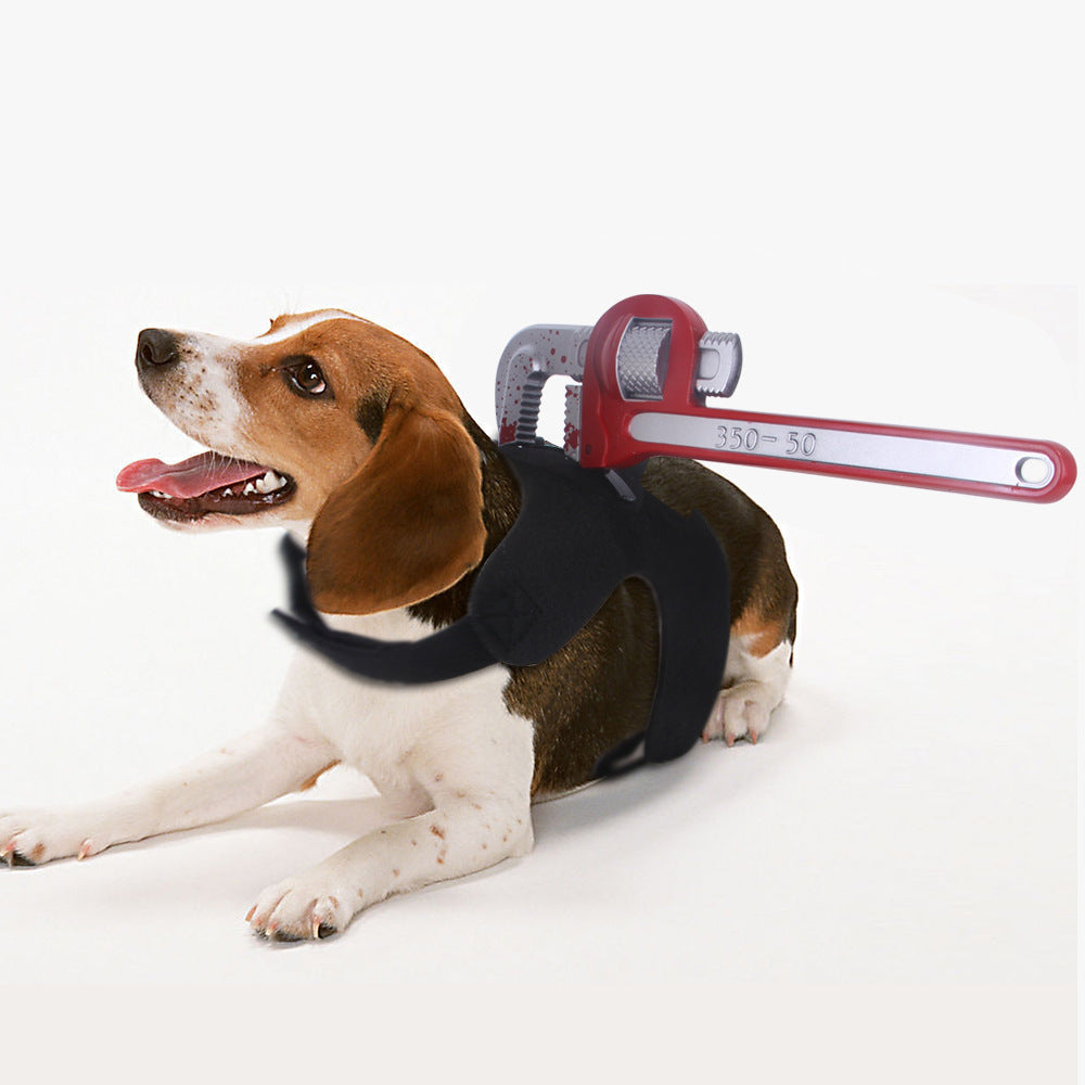 Beagle dog lying on white background wearing black harness with attached red chainsaw prop on back