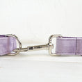 Load image into Gallery viewer, Close-up of durable silver leash clip attached to purple velvet leash
