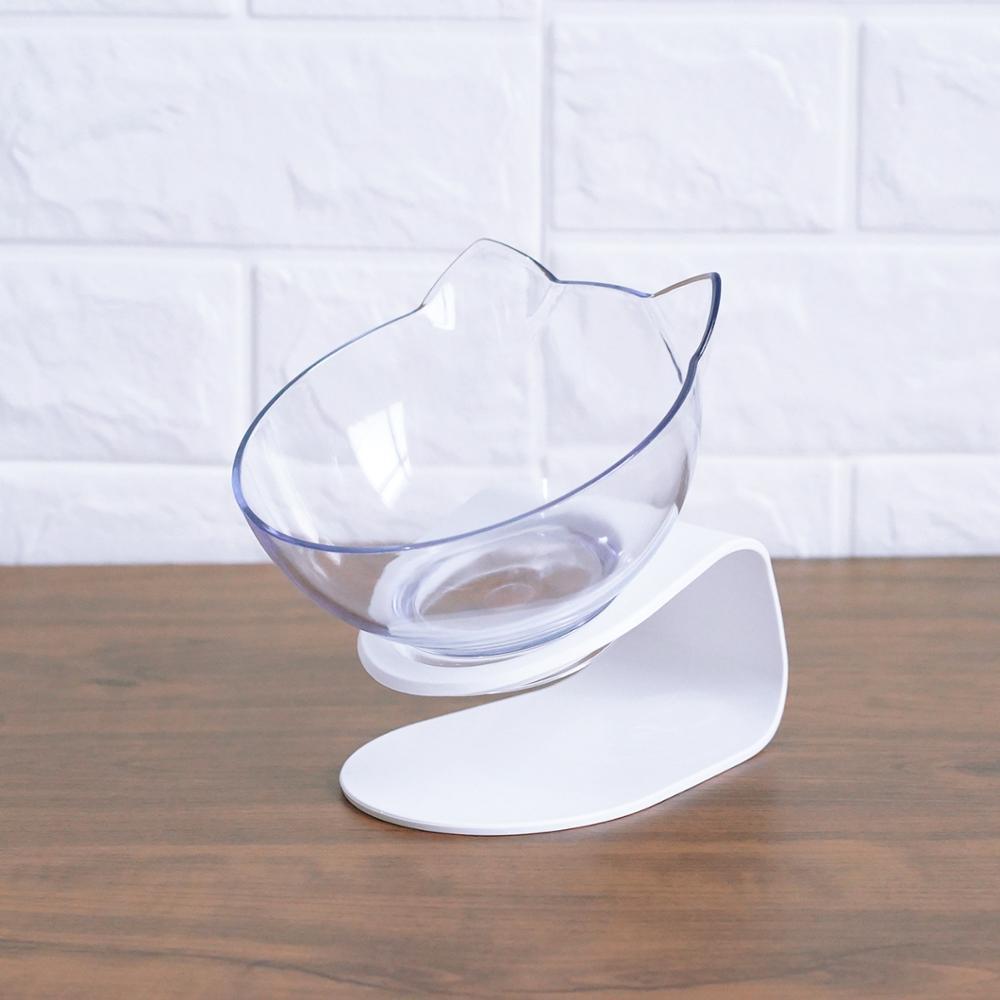 Single white cat ear bowl on tilted white stand against white background