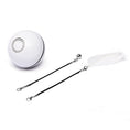 Load image into Gallery viewer, White LED light cat toy ball with detachable black string attachments including a white feather and a bell on white background
