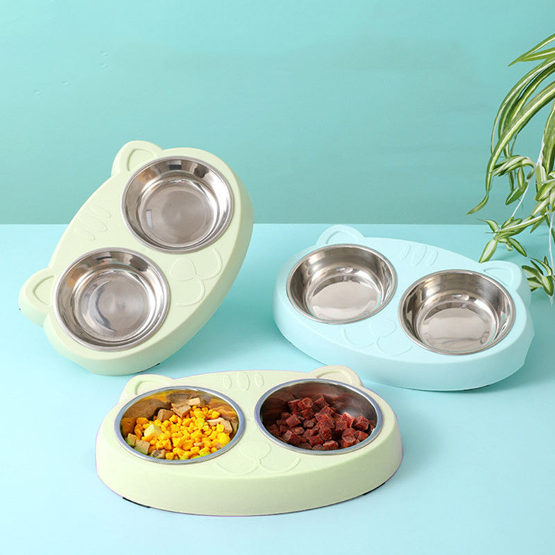 Three double bowl sets in pastel green and blue with stainless steel bowls, one elevated to show underside