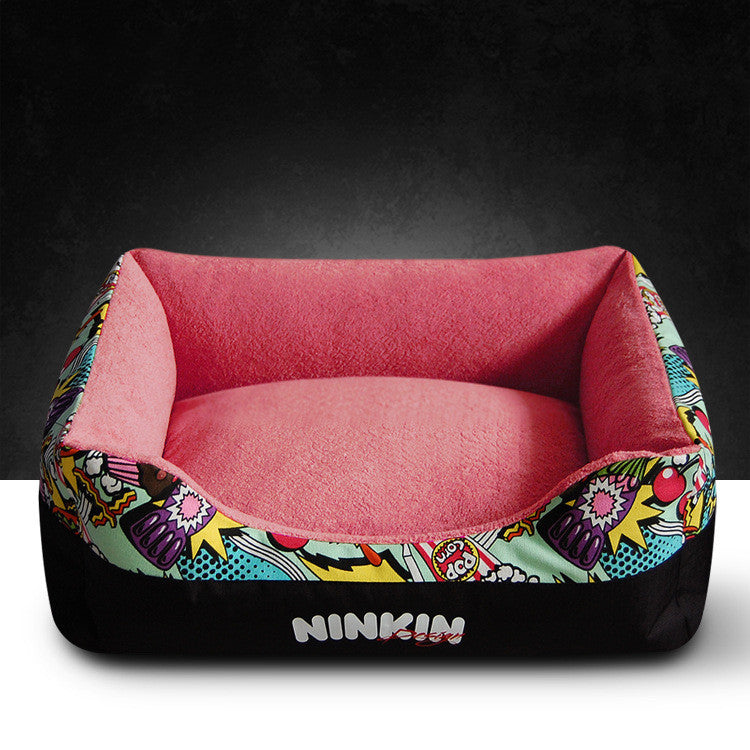 Dark red plush pet bed with colorful comic-style outer rim