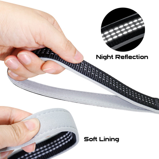 Black reflective stitched leash with soft inner lining shown in hand for comfort