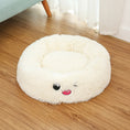 Load image into Gallery viewer, White plush round pet bed on wooden floor with winking embroidered face
