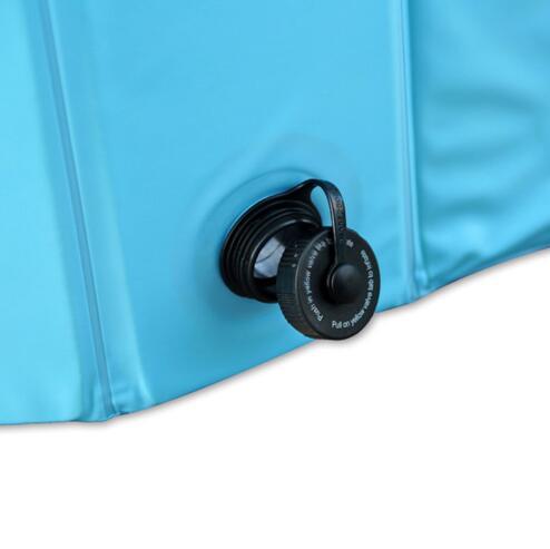 Close-up of water drain valve on light blue dog pool