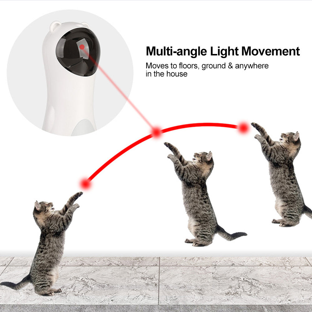 White automatic laser cat toy in shape of a bear projecting red laser light for multi-angle play with jumping gray tabby cat