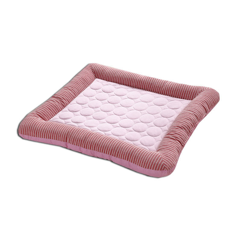 Single pink quilted cooling pet bed mat with striped cushions isolated on white background.