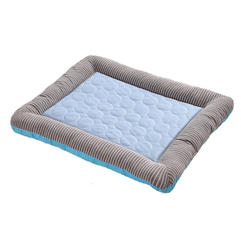 Single blue cooling pet bed mat with gray striped cushions isolated on white background.