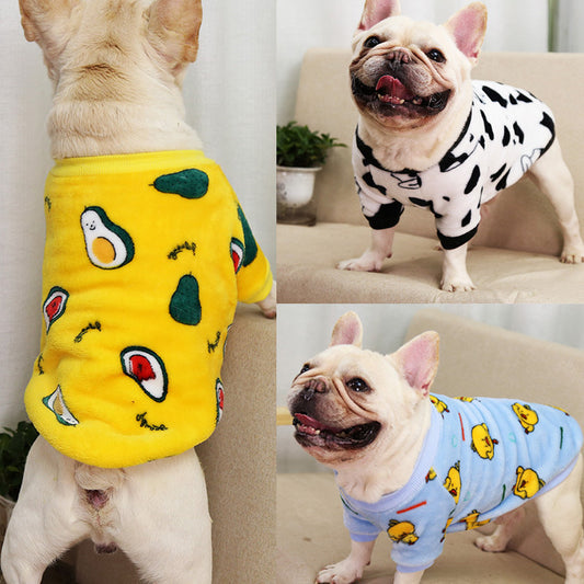 Dog wearing yellow coral fleece pajamas with avocado print, standing with back facing camera