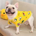 Cargar la imagen en la vista de la galería, Happy dog wearing yellow coral fleece pajamas with avocado and fruit print, standing on beige couch
