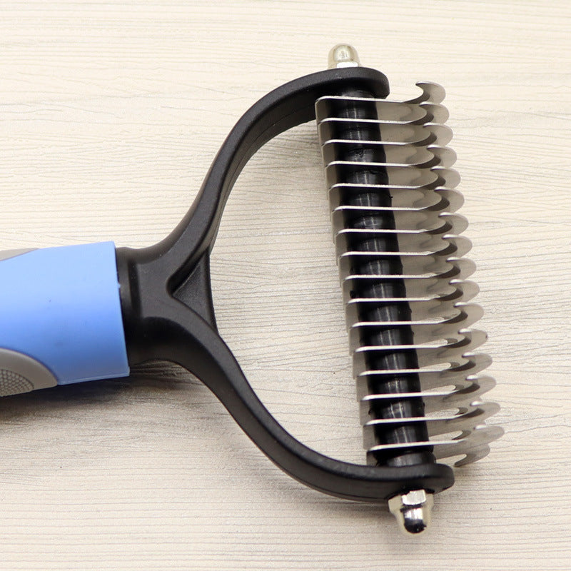 Dog comb with pink and grey handle showing ergonomic grip and blade structure