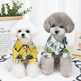 Load image into Gallery viewer, Two small dogs sitting side by side wearing tropical Hawaiian print shirts, one in yellow and one in white
