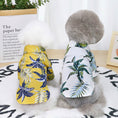 Load image into Gallery viewer, Back view of two dogs wearing Hawaiian short-sleeve shirts with tropical leaf and pineapple prints

