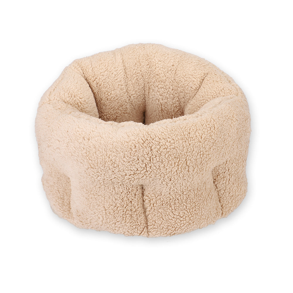 Light beige plush round pet bed shown isolated on white background