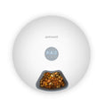 Load image into Gallery viewer, Top view of white automatic pet feeder with digital screen and dry pet food in compartment
