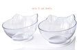 Load image into Gallery viewer, Pair of clear cat ear bowls on white elevated stand photographed against white brick wall
