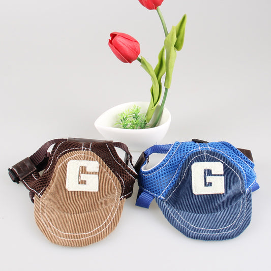 Two G-shaped embroidered dog hats side by side in brown and blue colors