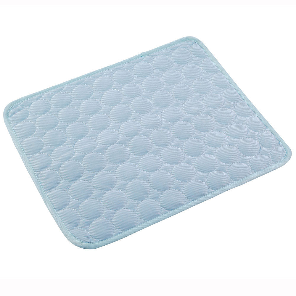 Light blue pet cooling mat displayed flat on wooden floor, size 100x70 cm