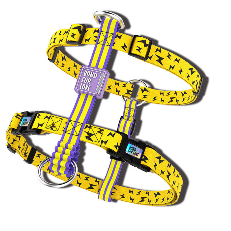 Close-up of yellow lightning bolt print dog harness vest showing buckle and leash ring details