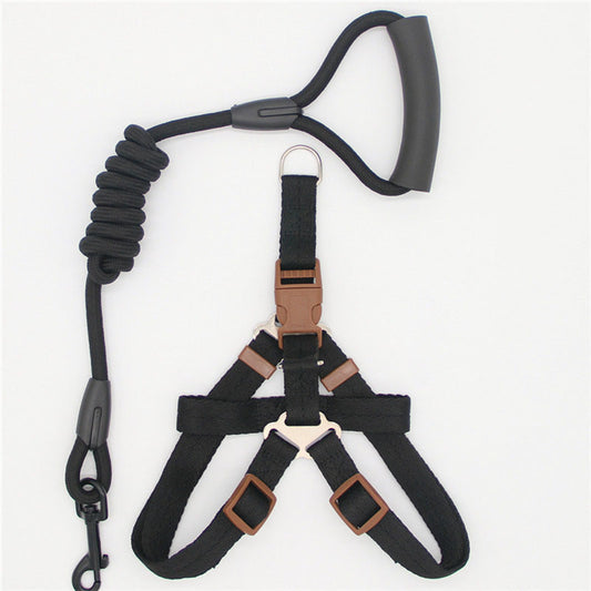 Black nylon dog harness with adjustable straps and matching shock-absorbing leash with padded handle
