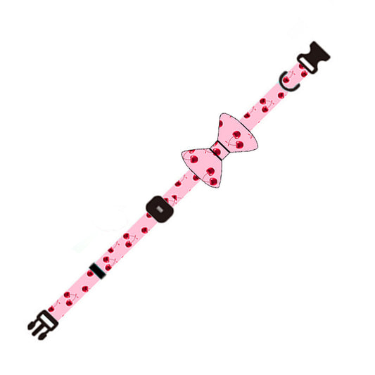 Close-up of pink cherry patterned adjustable dog collar with bowknot accessory