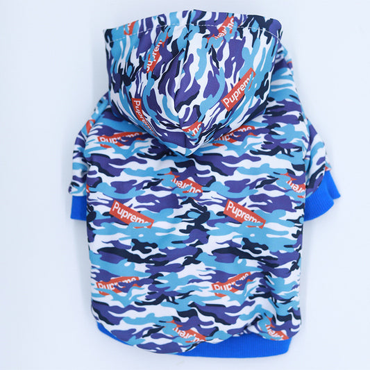 Blue camouflage dog hoodie with hood and ribbed cuffs laid flat showing back view
