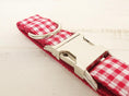 Load image into Gallery viewer, Detailed view of metal buckle and D-ring on red checkered polyester dog collar
