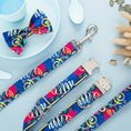 Load image into Gallery viewer, Complete dog collar, leash, and bow tie set styled on light blue surface with decor

