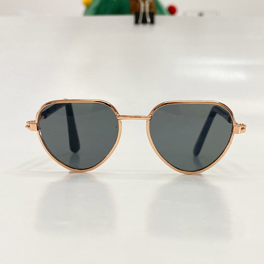 Close-up front view of aviator-style pet sunglasses with black lenses and rose gold frame