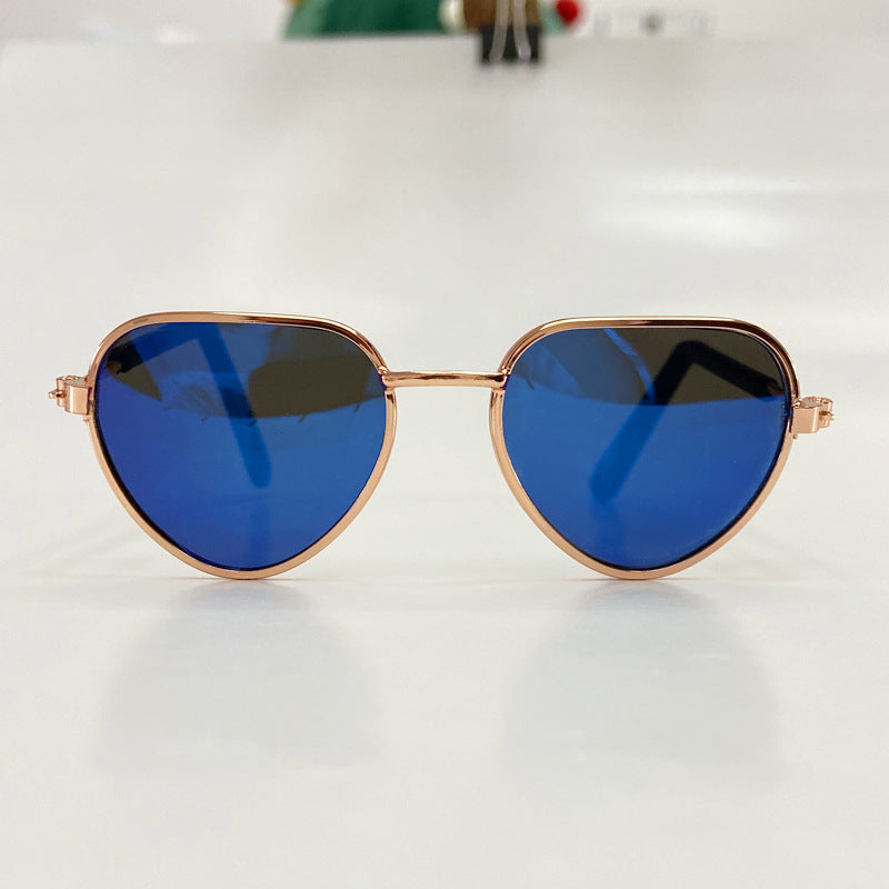 Aviator sunglasses with dark blue lenses and rose gold metal frame