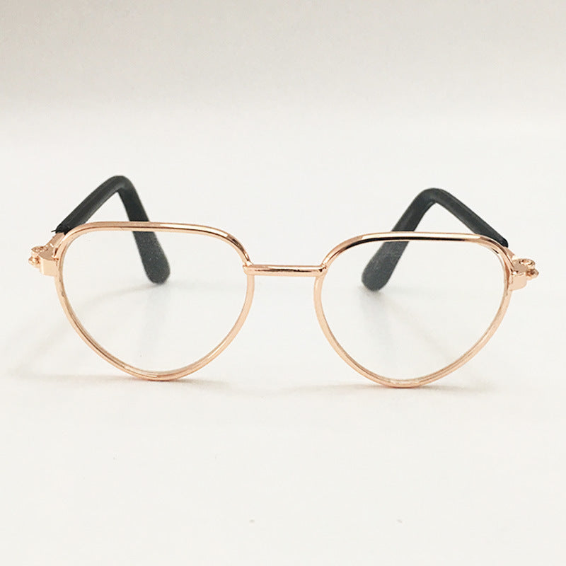 Clear lens aviator-style pet sunglasses with rose gold metal frame and black temple tips
