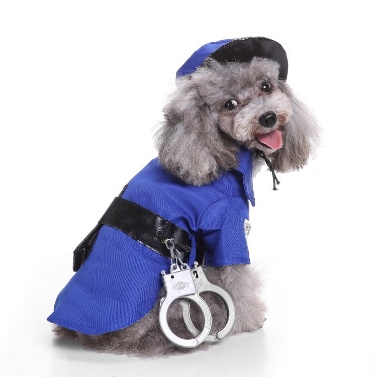 Small gray dog wearing a royal blue police costume with black belt and toy handcuffs, looking back smiling