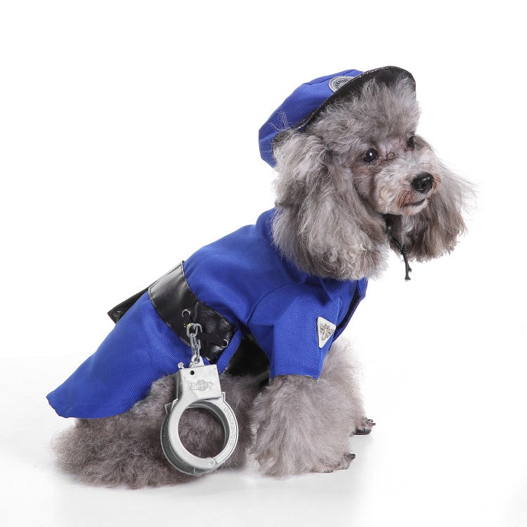 Small gray dog sitting wearing royal blue police costume and matching hat, looking sideways