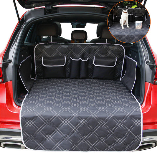 Black Oxford cloth dog mat covering car trunk with pockets and white stitching pattern