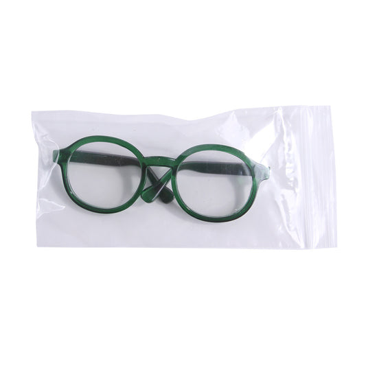 Green round plastic cat glasses in clear plastic packaging